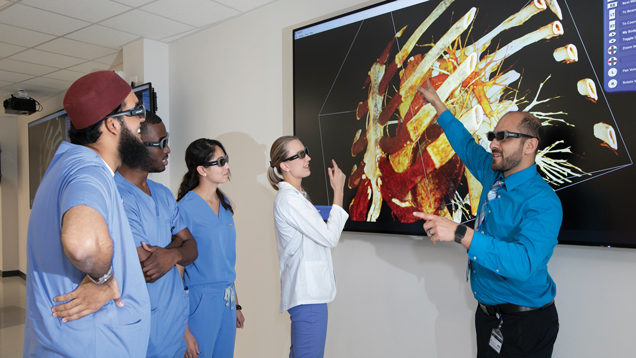 Simulation complex with studetns looking at screen.